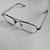 Black metal-framed eyeglasses on white background
