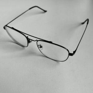 Black metal-framed eyeglasses on white background